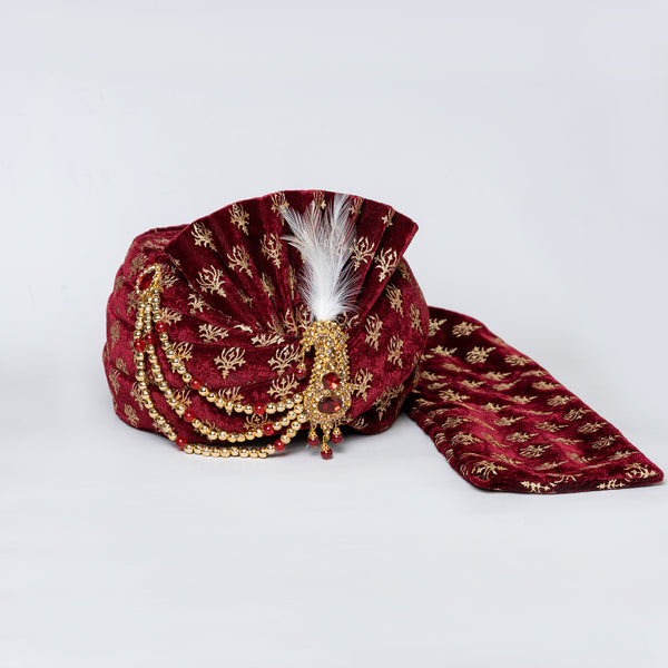 Angasudha Regal Maroon Embroidered Velvet Groom Pagdi with Stone Brooch & Feather Accent